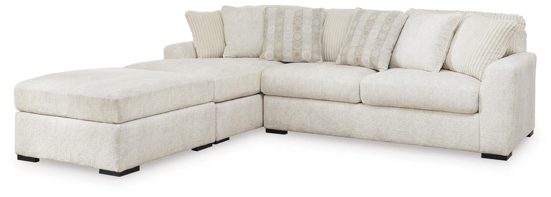 Ashley Furniture Chessington living room set with sofa and armchair in a modern design, shown in a cozy home setting.