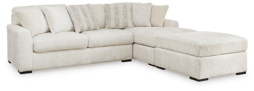 Ashley Furniture Chessington living room set with sofa and armchair in a modern design, featuring plush upholstery and wooden accents.