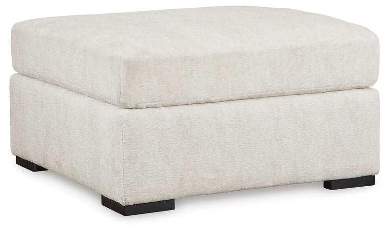Ashley Furniture Chessington living room set with sofa and armchair, featuring neutral upholstery and modern design.