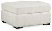 Ashley Furniture Chessington oversized accent ottoman with plush fabric and stylish design, shown from an angled side view.