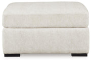 Ashley Furniture Chessington living room set with sofa and armchair, featuring neutral upholstery and modern design.