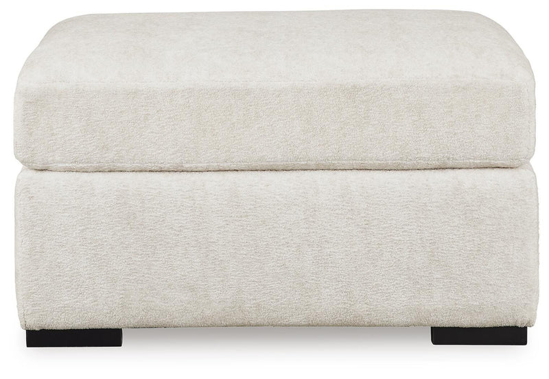 Ashley Furniture Chessington living room set with sofa and armchair, featuring neutral upholstery and modern design.