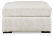 Ashley Furniture Chessington living room set with sofa and armchair, featuring neutral upholstery and modern design.