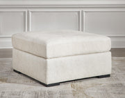 Ashley Furniture Chessington oversized accent Ottoman with beige fabric and tufted top, ideal for living room decor.
