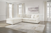 Ashley Furniture Chessington living room set with sofa and armchair, upholstered in neutral fabric, in a modern living space.