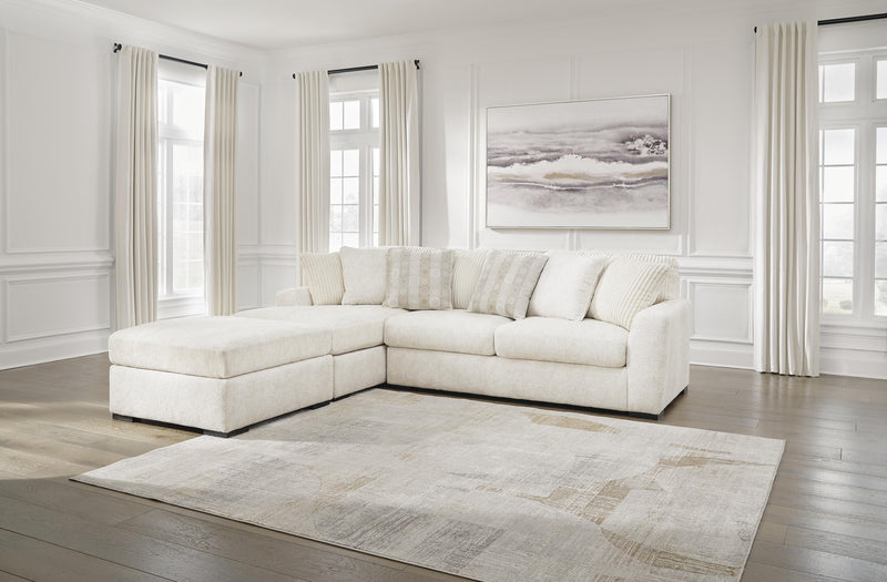 Ashley Furniture Chessington living room set with sofa and armchair, upholstered in neutral fabric, in a modern living space.