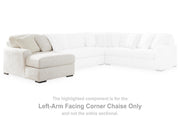 Ashley Furniture Chessington sectional with double chaise, beige fabric, plush cushions, and modern design for comfortable living room seating.