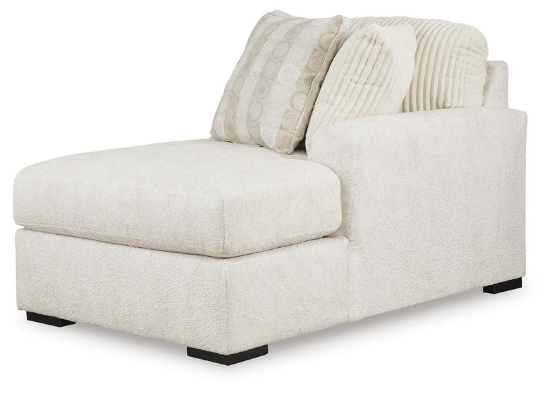Ashley Furniture Chessington living room set with sofa and armchair, featuring neutral upholstery and modern design.