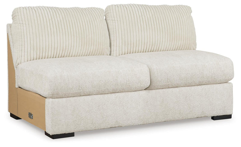 Ashley Furniture Chessington sectional with double chaise, featuring plush upholstery and modern design, shown from an angled view.
