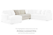 Ashley Furniture Chessington sectional with double chaise, featuring plush cushions and modern design in a cozy living room setup.