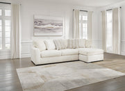 Ashley Furniture Chessington living room set with sofa, loveseat, and coffee table arranged in a modern living space.