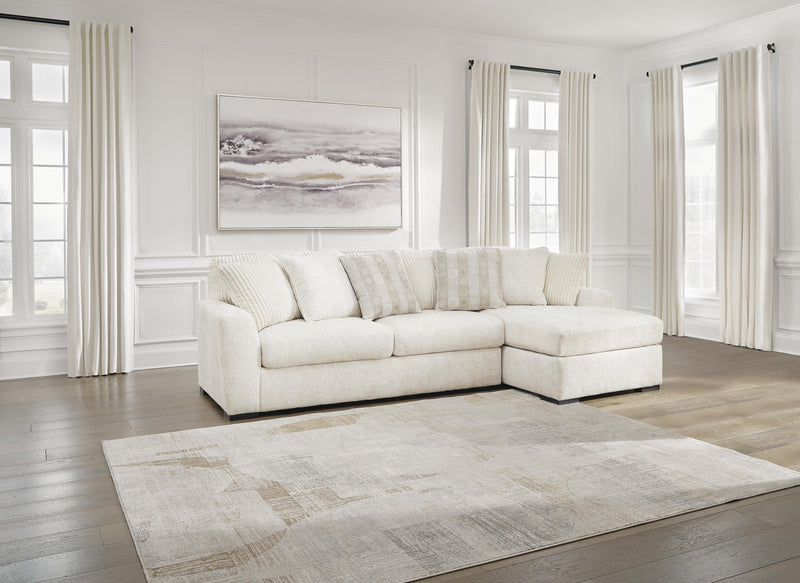Ashley Furniture Chessington living room set with sofa, loveseat, and coffee table arranged in a modern living space.