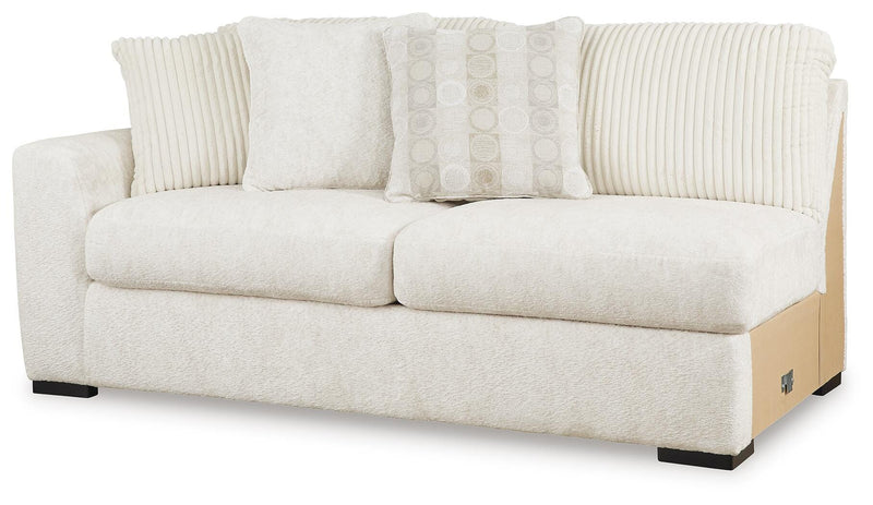 Ashley Furniture Chessington Living Room Set with sofa and armchair, featuring neutral upholstery and modern design.