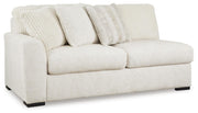 Ashley Furniture Chessington Sectional sofa shown from an angled view in a modern living room setting.