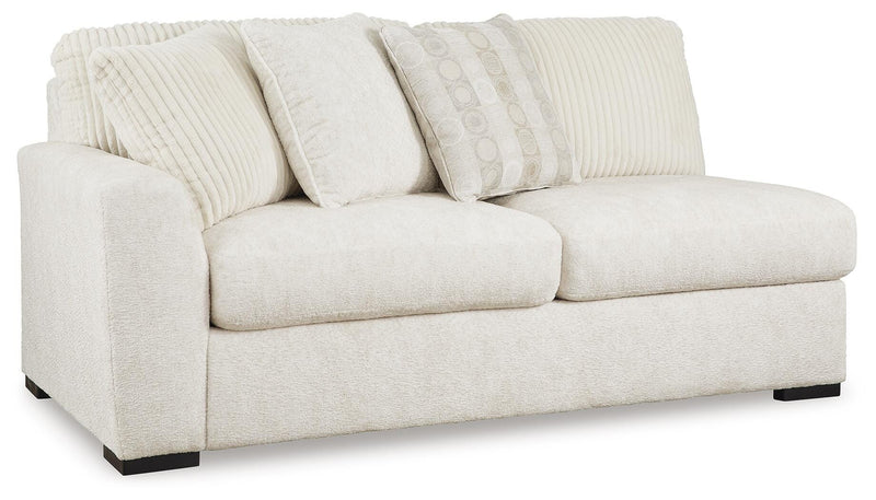 Ashley Furniture Chessington Sectional sofa shown from an angled view in a modern living room setting.