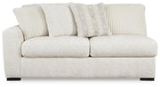 Ashley Furniture Chessington living room set with sofa, loveseat, and coffee table arranged in a modern design.