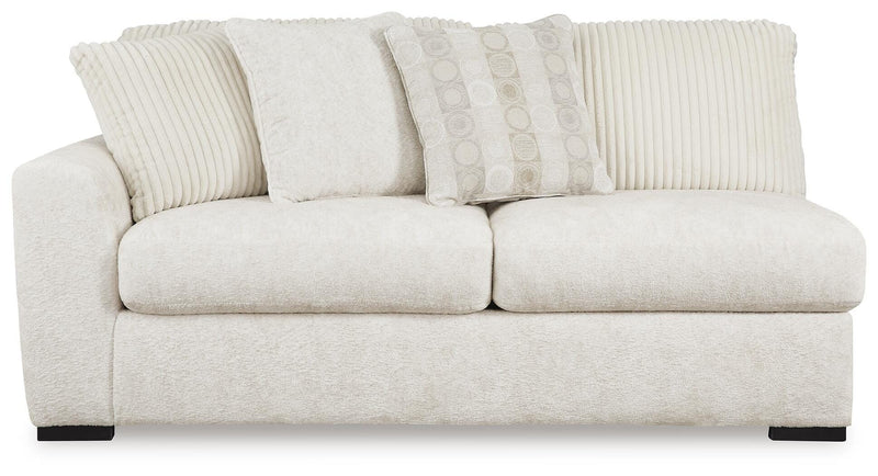 Ashley Furniture Chessington living room set with sofa, loveseat, and coffee table arranged in a modern design.