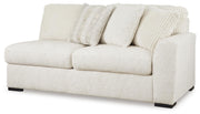 Ashley Furniture Chessington living room set with sofa and armchair, featuring neutral fabric upholstery and modern design.