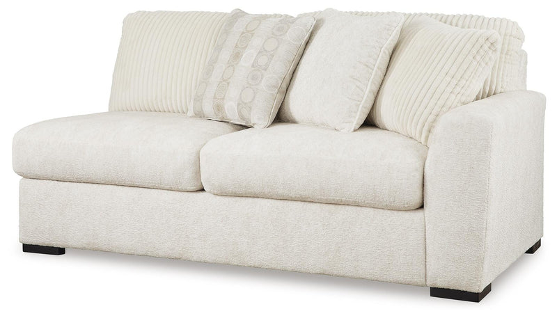 Ashley Furniture Chessington living room set with sofa and armchair, featuring neutral fabric upholstery and modern design.