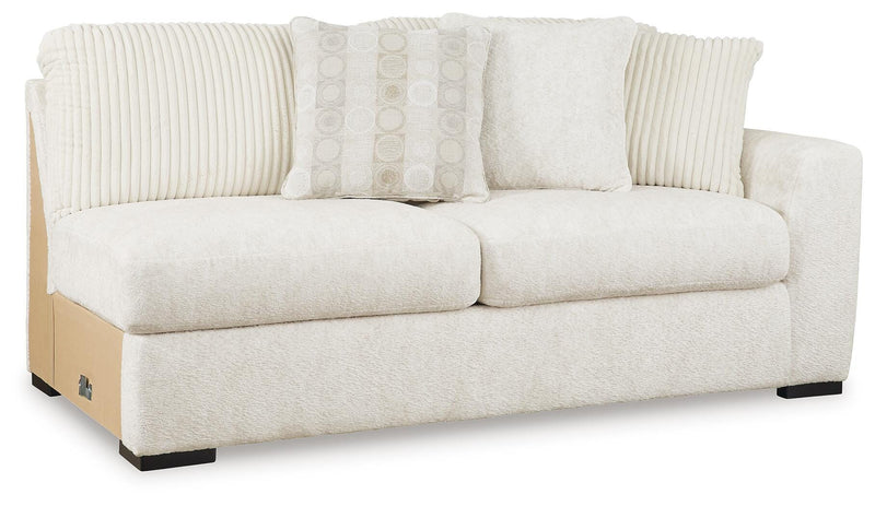 Ashley Furniture Chessington living room set shown from an angled view, includes sofa and loveseat with neutral fabric upholstery.