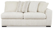 Ashley Furniture Chessington living room set with sofa and armchair, upholstered in neutral fabric, shown from a front head-on view.
