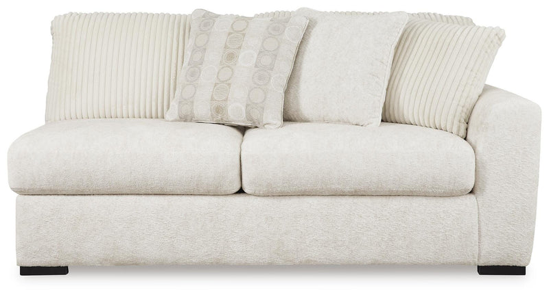 Ashley Furniture Chessington living room set with sofa and armchair, upholstered in neutral fabric, shown from a front head-on view.