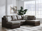 Ashley Furniture Castille Way sleeper sectional with chaise, showing plush fabric upholstery and spacious seating arrangement.