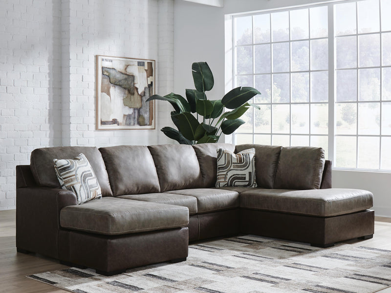 Ashley Furniture Castille Way sleeper sectional with chaise, showing plush fabric upholstery and spacious seating arrangement.