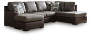 Ashley Furniture Castille Way sleeper sectional with chaise showing soft fabric upholstery and spacious seating arrangement.