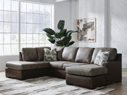 Ashley Furniture Castille Way sectional with chaise showing beige upholstered fabric, sectional layout, and plush cushions.
