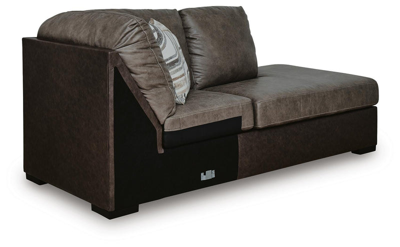 Ashley Furniture Castille Way sleeper sectional with chaise, shown from an angled side view, featuring plush cushions and a modern design.