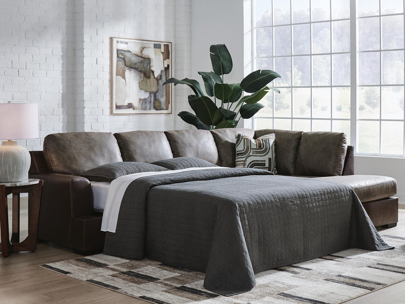 Ashley Furniture Castille Way sleeper sectional with chaise, featuring plush upholstery and modern design in a cozy living room setting.