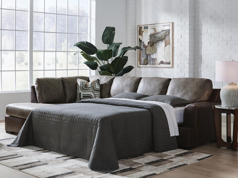 Ashley Furniture Castille Way sleeper sectional with chaise, featuring plush cushions and a modern design in neutral fabric.