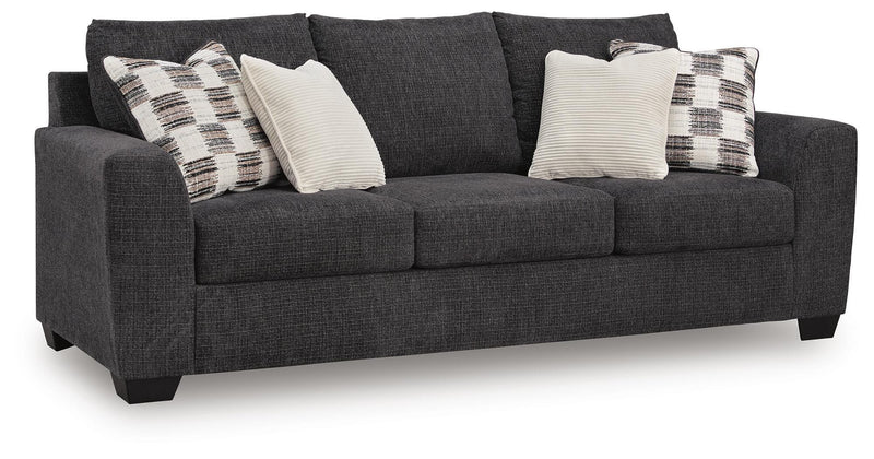 Ashley Furniture Loreo sofa with plush fabric, angled view showing comfortable cushions and modern design in a cozy living room setting.