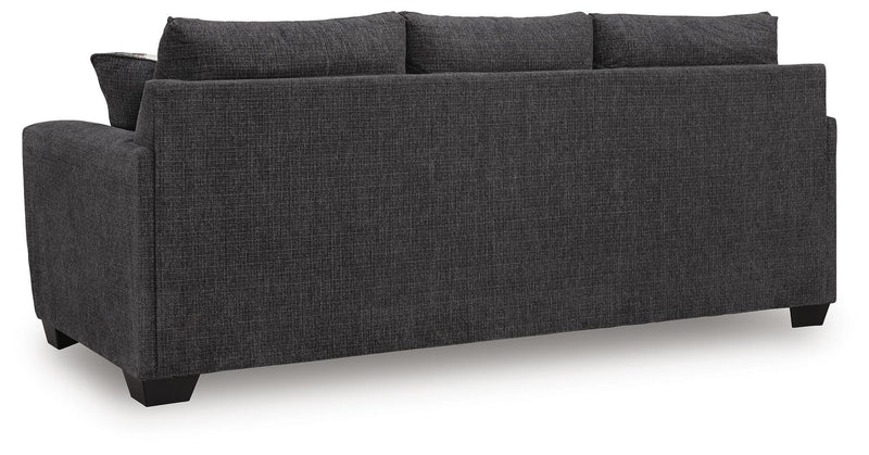 Ashley Furniture Loreo sofa with plush back cushions and modern design, shown from the back view in the image.