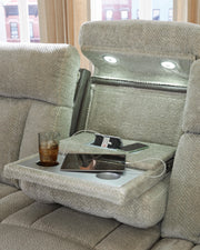 Ashley Furniture WhipLash Power Reclining Sofa with plush cushions and reclining features, shown in a modern living room setting.