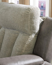Ashley Furniture WhipLash Power Reclining Sofa with plush cushioning and reclining features, shown in a modern living room setting.