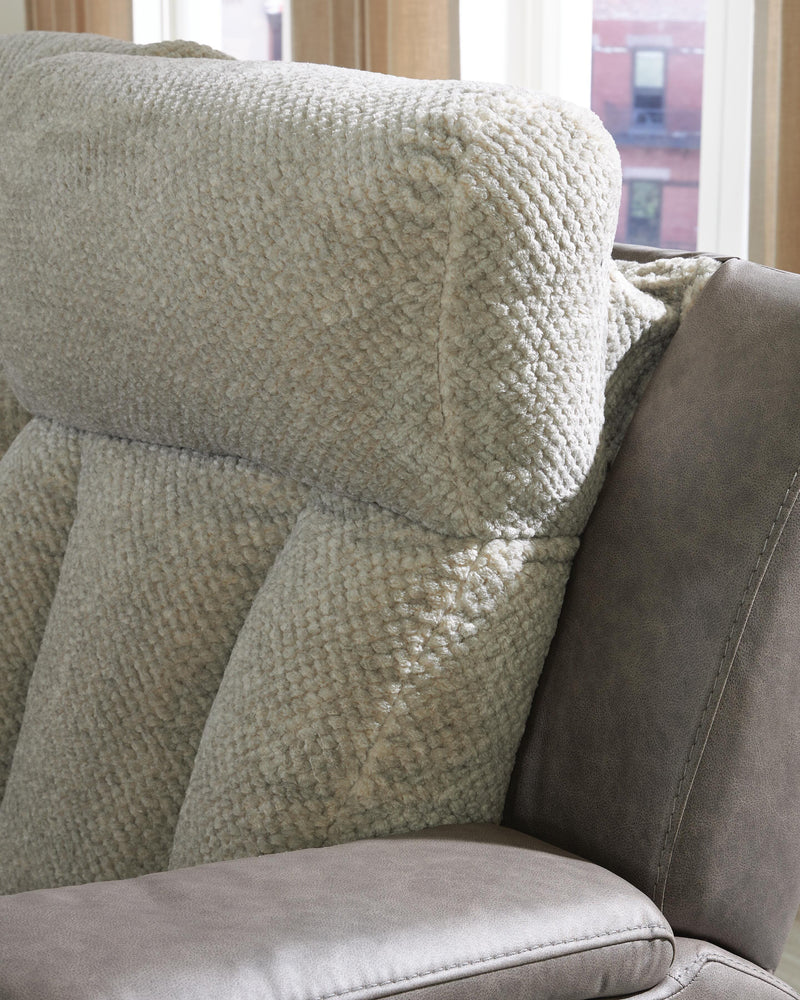 Ashley Furniture WhipLash power reclining loveseat with console, featuring plush upholstery and built-in cup holders for comfort and convenience.