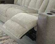 Ashley Furniture WhipLash Power Reclining Sofa with plush cushions and reclining features in a modern living room setting.