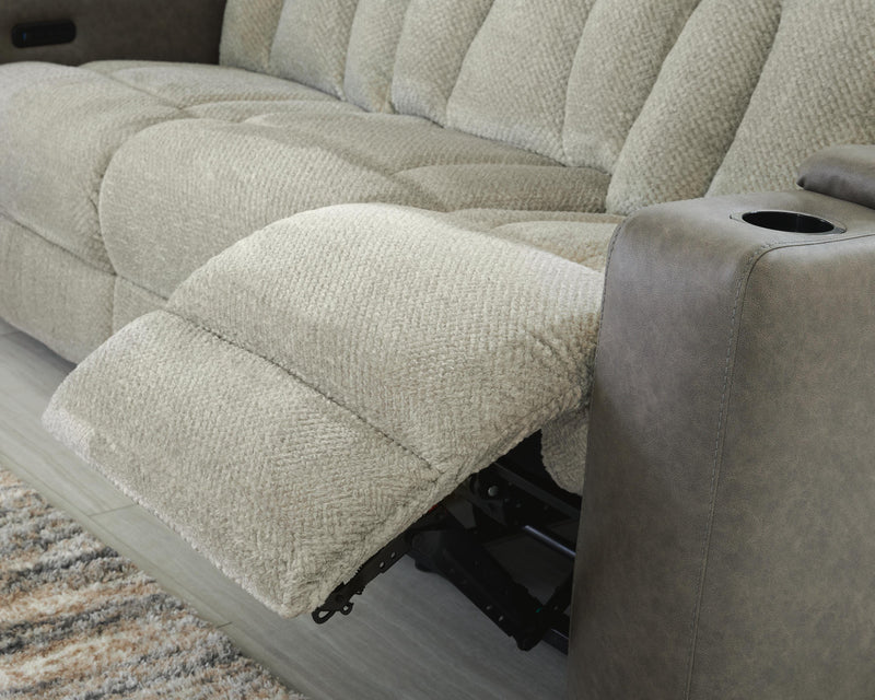 Ashley Furniture WhipLash Power Reclining Sofa with plush cushions and reclining features in a modern living room setting.