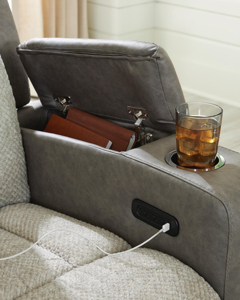 Ashley Furniture WhipLash Power Reclining Sofa with USB charging port, plush fabric, and built-in cup holders for comfort and convenience.