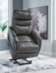 Ashley Furniture Strawbill Power Lift Recliner in beige fabric, showing the reclined position with plush cushioning and wooden base.