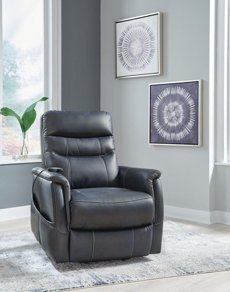 Ashley Furniture Strawbill Power Lift Recliner, closed view showing padded armrests and plush upholstery in a cozy living room setting.