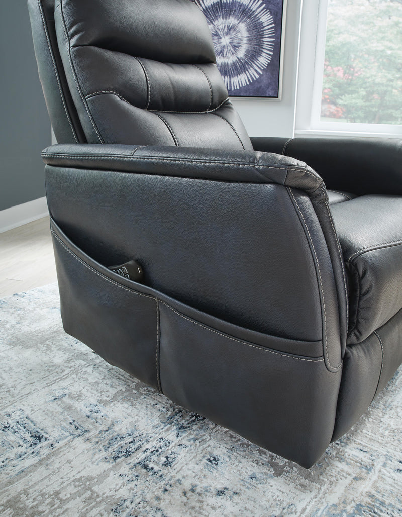 Ashley Furniture Strawbill Power Lift Recliner with padded armrests and plush upholstery, shown in a detailed close-up.
