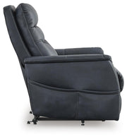Ashley Furniture Strawbill Power Lift Recliner showing plush upholstery and side control panel in a cozy living room setting.