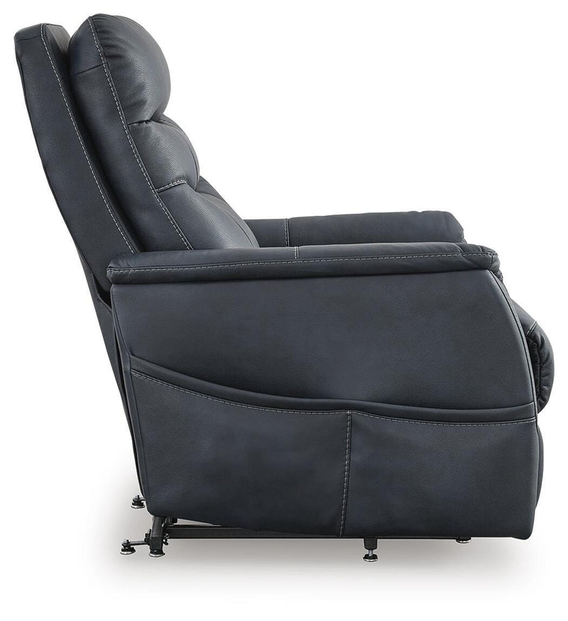 Ashley Furniture Strawbill Power Lift Recliner showing plush upholstery and side control panel in a cozy living room setting.