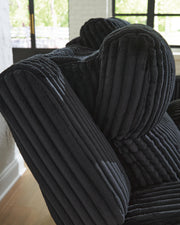 Forest Lake power reclining loveseat with console by Ashley Furniture, showing plush fabric, reclining mechanism, and built-in cup holders.
