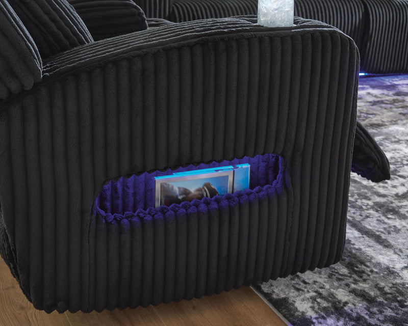 Ashley Furniture Forest Lake power reclining sofa with side storage, featuring plush cushions and a dark fabric finish.