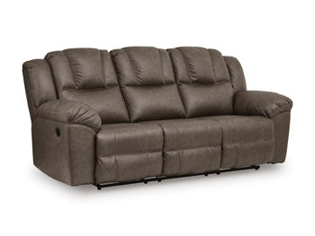 Ashley Furniture Lowilla living room set with sofa and loveseat, upholstered in neutral fabric, from a front and side angle.