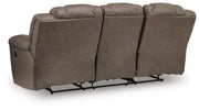 Ashley Furniture Lowilla living room set featuring a sofa and matching armchair with neutral upholstery and modern design.